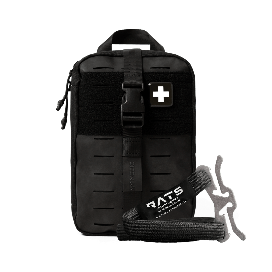 Black tactical first aid kit pouch with a front buckle strap, a white medical cross patch, and a black emergency tourniquet