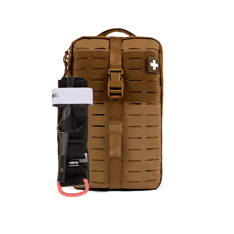 A tan tactical first aid pouch with MOLLE webbing, a front buckle strap, and a white cross patch, shown alongside a black tourniquet with a white band and red ring on a white background.