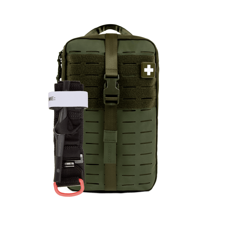 An olive green tactical first aid pouch with a front buckle closure and a white cross patch, shown with a black and white emergency windlass tourniquet attached on the left side.