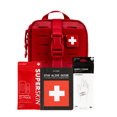 My Medic First Aid Kit, a red SuperSkin Bandage 12-pack pouch, a Stay Alive Guide booklet, and a Zips 2-pack hand bandage pouch, arranged on a transparent background.