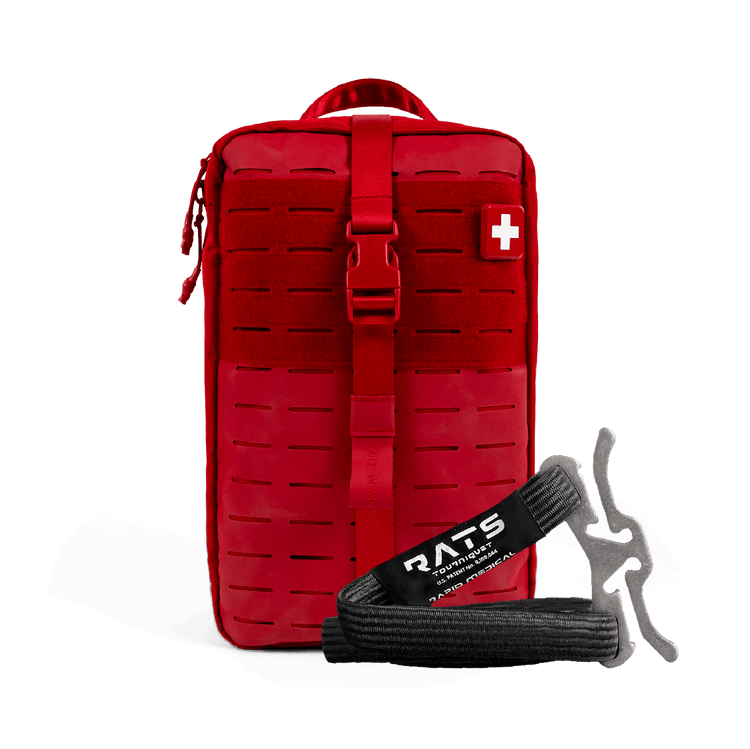 A red tactical first aid kit pouch with a front buckle strap and a white cross patch, shown on a black background with a black and gray RATS emergency tourniquet in front.