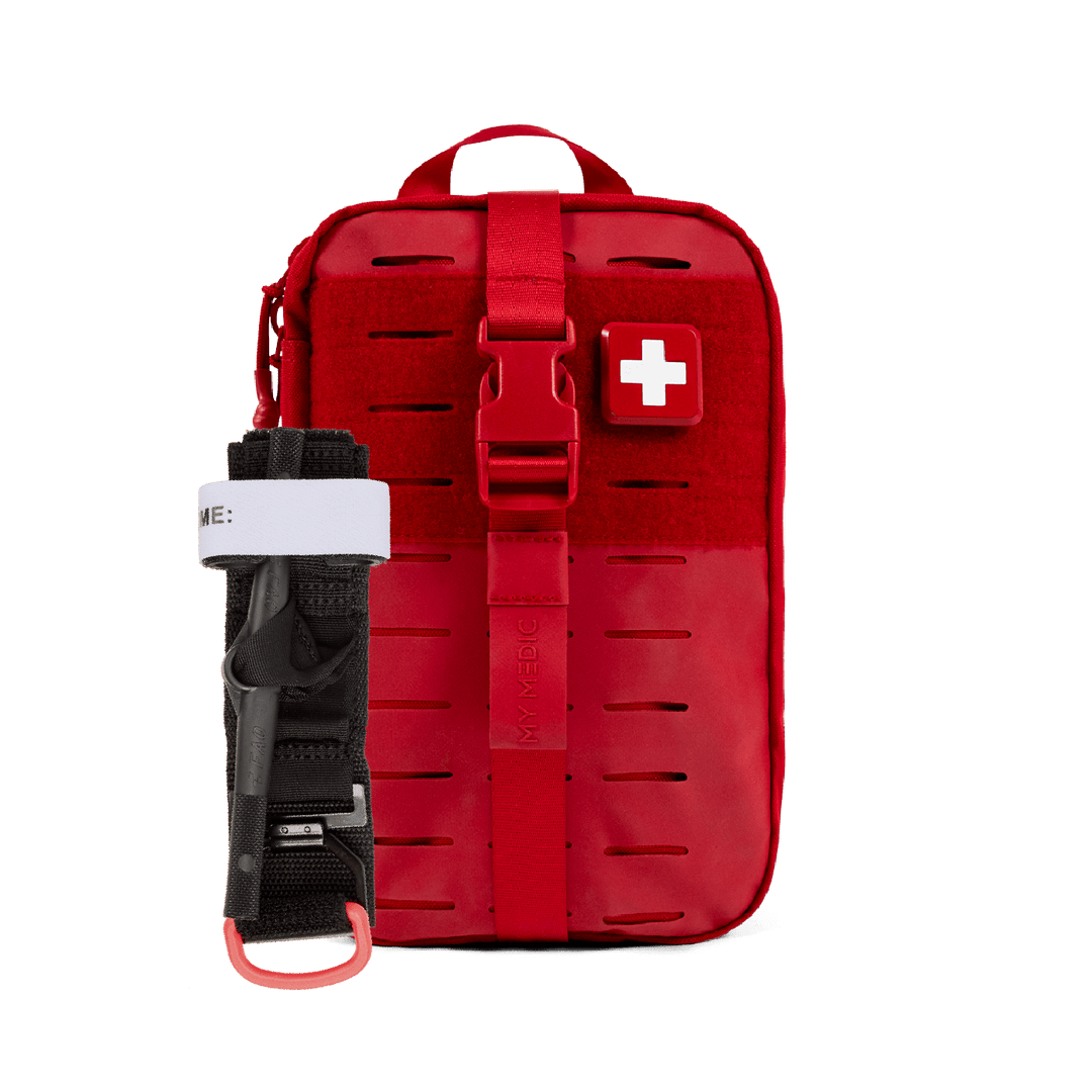 A red tactical first aid kit with a quick-release buckle and a white cross symbol on the front, shown alongside a windlass black tourniquet on a white background.